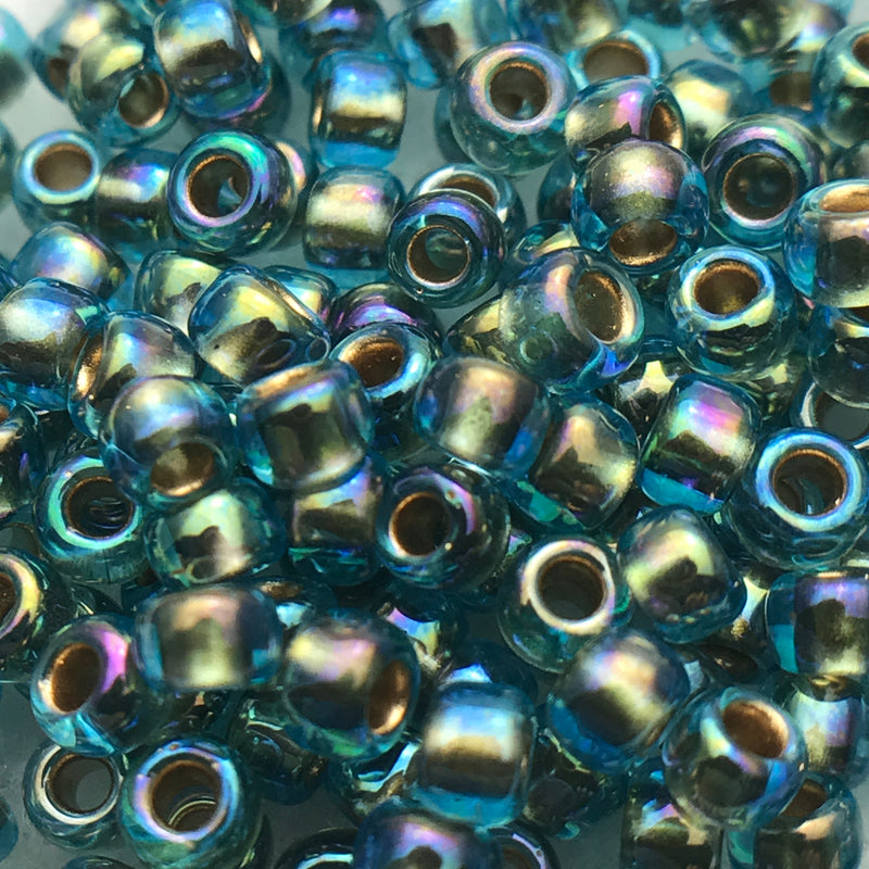 cAqua Transparent Gold Lined Rainbow, 8/0 Toho Round, 8.5 grams