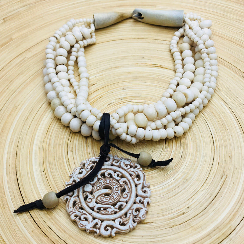 5 strand white wood with removable Carved Stone Pendant